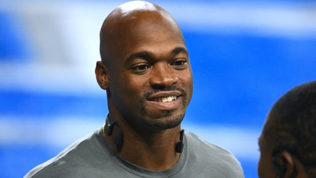 Running back Adrian Peterson warms up before a game for the Detroit Lions.